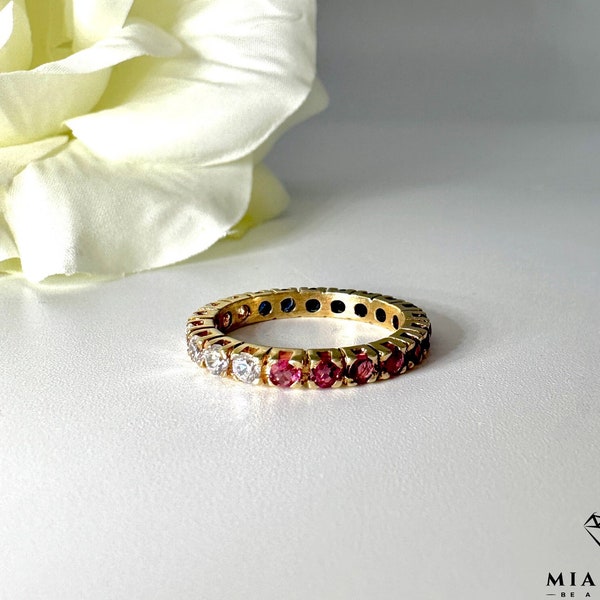 Memoire ring made of 585 / 14 carat yellow gold with sapphire, ruby and zirconia