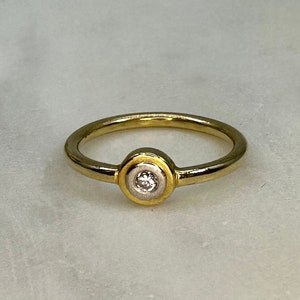 Solitaire ring set with 0.06ct diamond in solid 585 yellow gold ring band