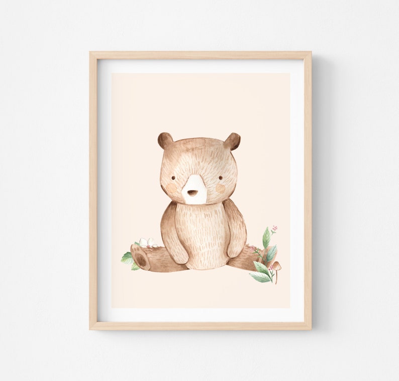 May include: A watercolor illustration of a brown bear sitting on a log with green leaves and white flowers. The background is a light peach color.