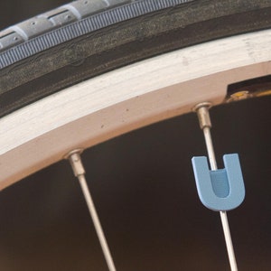 Letter &quot;U&quot; Bike Spoke Decoration. Fits on bicycle wheel spokes. Accessory clips onto bike spokes like spoke beads. Made in USA.