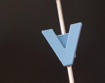 Letter "V" Bike Spoke Decoration. Fits on bicycle wheel spokes. Accessory clips onto bike spokes like spoke beads. Made in USA.
