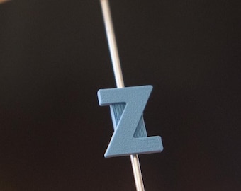Letter "Z" Bike Spoke Decoration. Fits on bicycle wheel spokes. Accessory clips onto bike spokes like spoke beads. Made in USA.