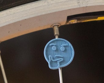Thinking Face Emoji - Bike Spoke Decoration. For bicycle wheel spokes. Accessory clips onto spokes. Made in USA.
