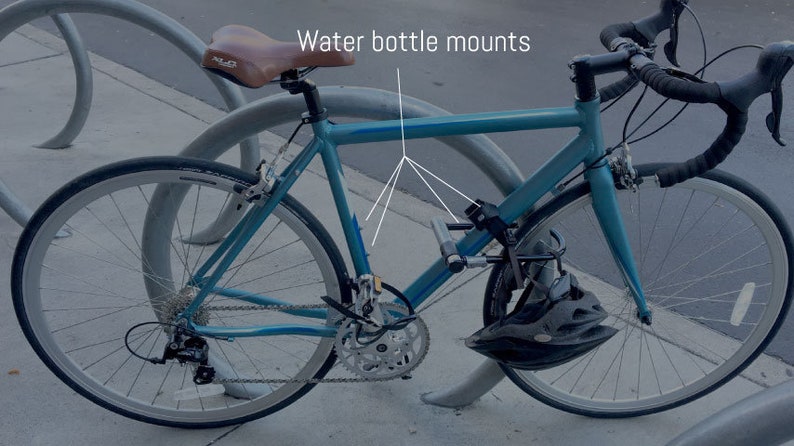 This picture shows where the water bottle mounts are on a standard bicycle, for attaching the Bike Sight AirTag holder. No water bottle cage necessary.