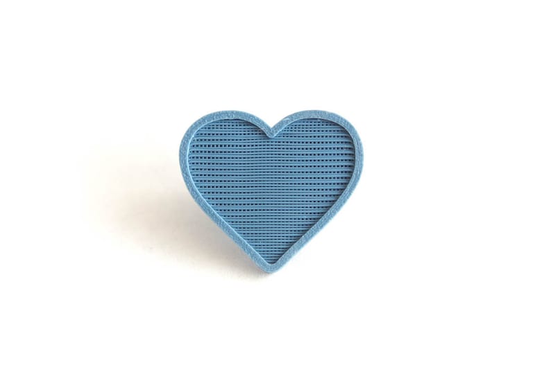 May include: A blue heart-shaped object with a textured surface.