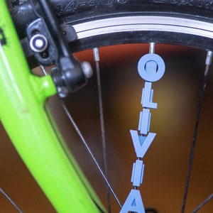 Bike Spoke Decoration Letters. 6 letter set. Fits on bicycle wheel spokes. Accessory clips onto bike spokes like spoke beads. Made in USA. image 6