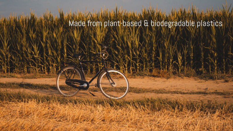 Bicycle in front of cornfield. Plastic used for the AirTag holder is made from bio-based sources.