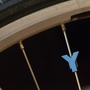 Letter &quot;Y&quot; Bike Spoke Decoration. Fits on bicycle wheel spokes. Accessory clips onto bike spokes like spoke beads. Made in USA.