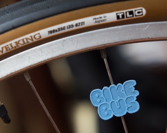 Bike Bus spoke decoration. Fits on bicycle wheel spokes. Accessory clips on bike spokes like beads & ornaments. Made in USA
