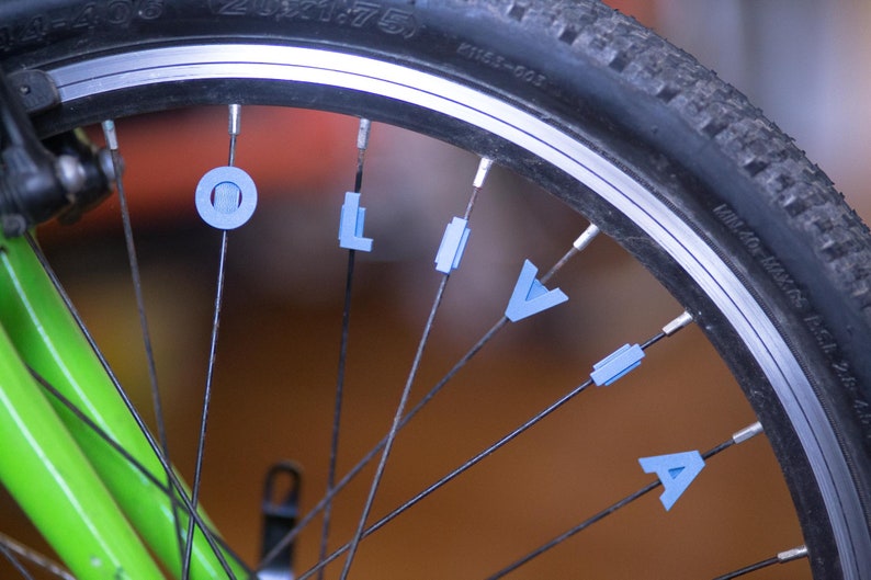 Bike Spoke Decoration Letters. 6 letter set. Fits on bicycle wheel spokes. Accessory clips onto bike spokes like spoke beads. Made in USA. image 5