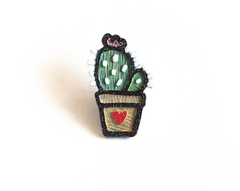 Cute cactus in a pot with a heart spoke decoration. Fits bicycle wheels. Accessory clips like spoke beads & ornaments, charms. Made in USA