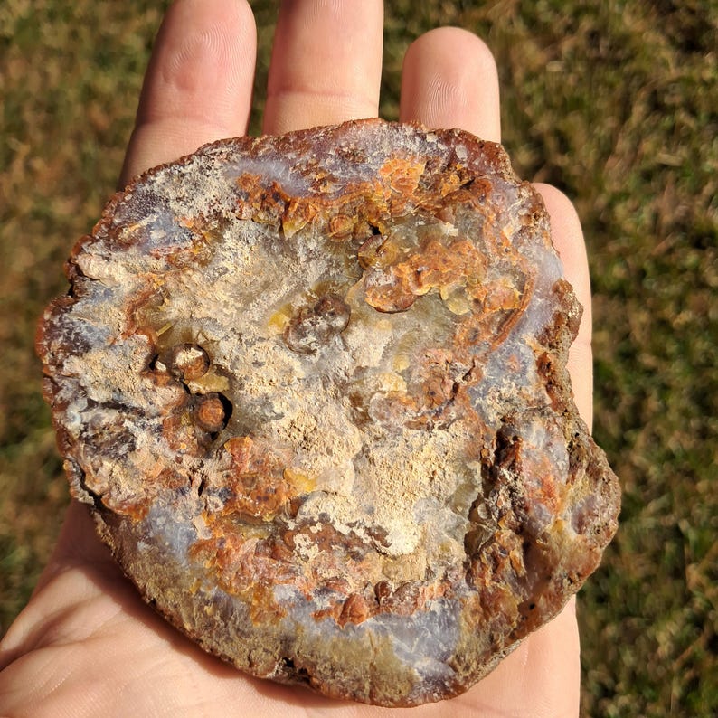 Moroccan agate from the high atlas mountains, also known as hama agate. Polished eye agate mineral specimen with quartz.