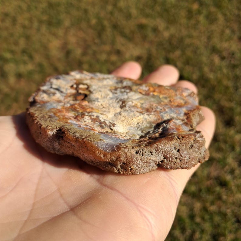 Moroccan agate from the high atlas mountains, also known as hama agate. Polished eye agate mineral specimen with quartz.