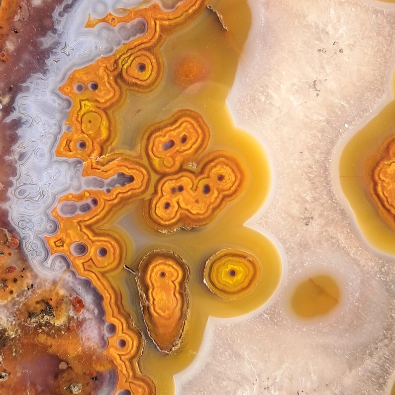 Moroccan agate from the high atlas mountains, also known as hama agate. Polished eye agate mineral specimen with quartz.