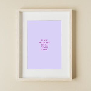 May include: A framed print with a light purple background and the text "If you never try, you'll never know" in pink.
