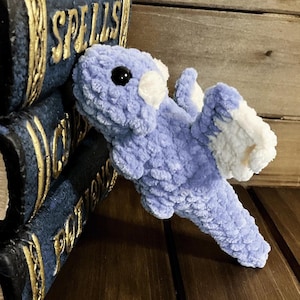 May include: A rustic wooden sign with the text "Welcome to our home" in white lettering. The sign features a distressed finish and a simple, inviting design, perfect for front door decor.