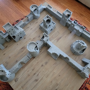 Ruins of Valor: Modular Ruined 3d Printed Castle. Rearrange the walls turrets and keeps to form infinite configurations and possibilities!