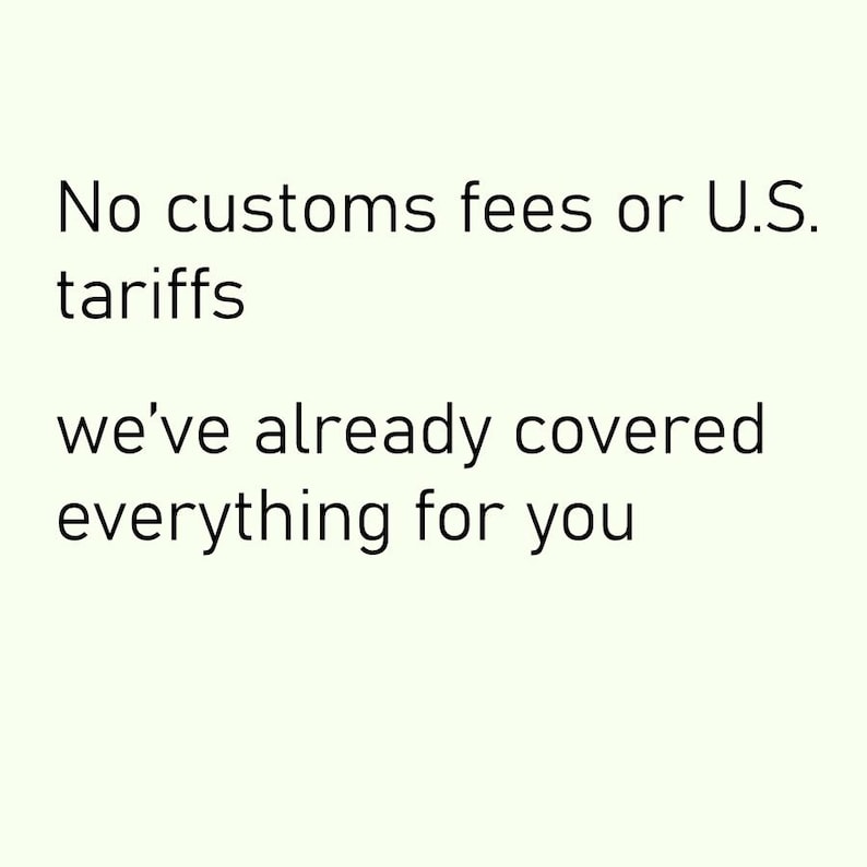 May include: Image with a white background and black text. The text states: "No customs fees or U.S. tariffs. We've already covered everything for you."