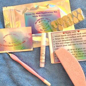 Press on nail Application kit Nail glue, Buffer, Cuticle pusher.