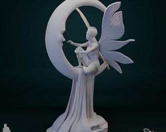 May include: A white 3D printed miniature figurine of a fairy sitting on a crescent moon. The fairy has wings and is holding a staff. The base of the figurine is a flowing cloth. The figurine is 75mm in scale.