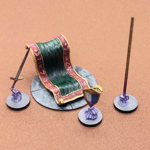 May include: A miniature tabletop game set with a green and red rug, a sword, a shield, and a staff. The rug has pink writing on it.