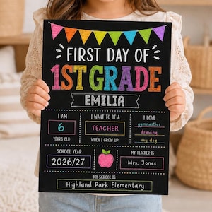 May include: A black chalkboard sign with colorful text and graphics reading First Day of 1st Grade, Emilia, 6 years old, Teacher, gymnastics, drawing, my dog, 2026/27, Mrs. Jones, and Highland Park Elementary, decorated with a bunting banner.