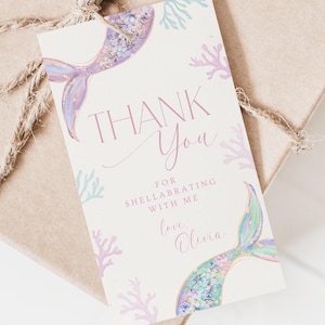 May include: Thank you card with a mermaid tail and coral design. The card says "Thank You" and "For celebrating with me. Love, Olivia."
