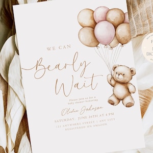 May include: A baby shower invitation featuring a teddy bear holding balloons. The invitation reads "We can Bearly Wait" and includes the date, time, and location of the shower. The text "Our Dearest Moments Design Co." is at the bottom of the invitation.