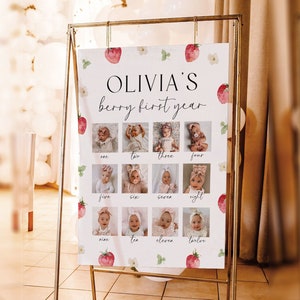 K&ouml;nnte beinhalten: Ein wei&szlig;er Poster mit Erdbeer-Motiv f&uuml;r eine erste Geburtstagsfeier. Der Poster sagt "Olivia's Berry First Year" und zeigt 12 Fotos eines kleinen M&auml;dchens, eines f&uuml;r jeden Monat des Jahres.