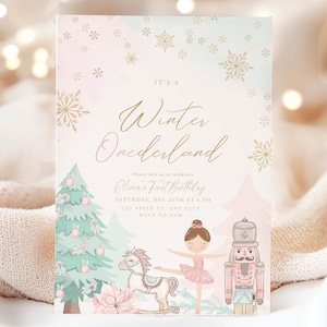 May include: A pink and blue winter wonderland themed first birthday party invitation with a ballerina, a nutcracker, and a rocking horse. The text reads "It's a Winter Onederland, Olivia's First Birthday, Saturday, Dec 20th at 4 PM, 123 Apple St., Any City, RSVP to Sam".