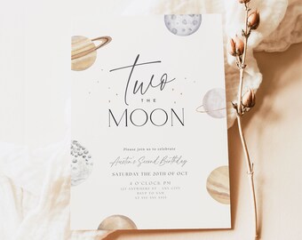 May include: A white invitation card with a watercolor illustration of planets and stars. The text reads "Two the Moon" and includes details for Austin's Second Birthday party on Saturday, October 20th at 4:00 PM. The invitation also includes the address and RSVP information.