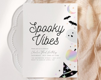 May include: A white invitation card with black text that reads "Spooky Vibes" and "Charlie's Third Birthday". The card is decorated with a rainbow pumpkin, a witch's hat, a ghost, bats, and stars.