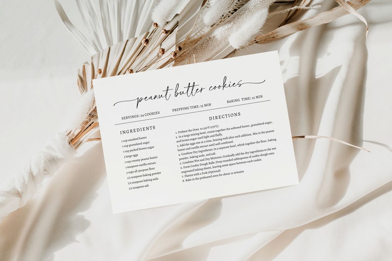 May include: A printable recipe card for peanut butter cookies. The card has a white background with black text. The recipe includes ingredients and directions for making the cookies. The card is decorated with a simple, handwritten font.