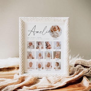 May include: A white framed photo collage of a baby girl's first year. The collage includes 12 photos of the baby at different ages, from newborn to 12 months. The photos are arranged in a grid pattern, with the baby's name "Amelia" and the date and time of her birth printed at the top. The text "My First Year" is also printed at the top.