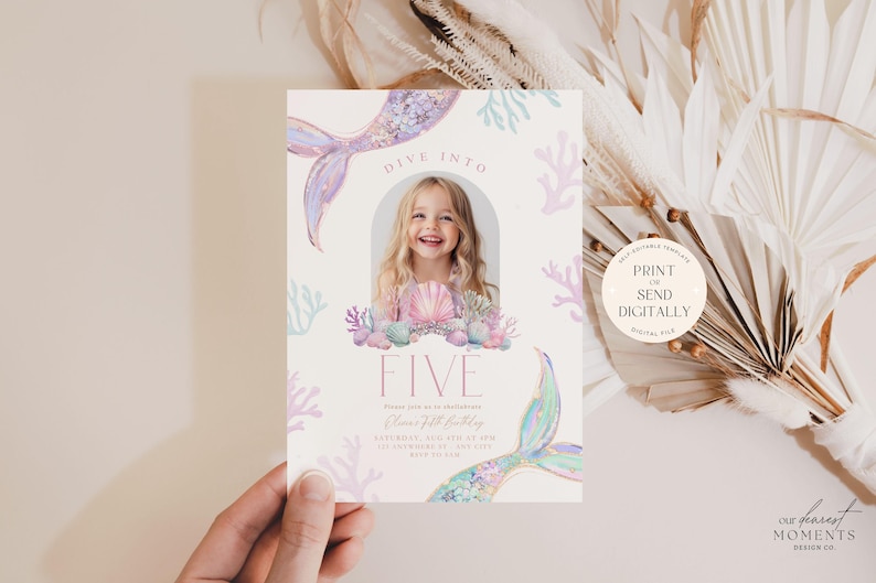May include: A printable invitation for a 5th birthday party with a mermaid theme. The invitation features a watercolor illustration of a mermaid tail, seashells, and coral. The text "Dive into Five" is written in pink and white. The invitation is designed to be printed or sent digitally.