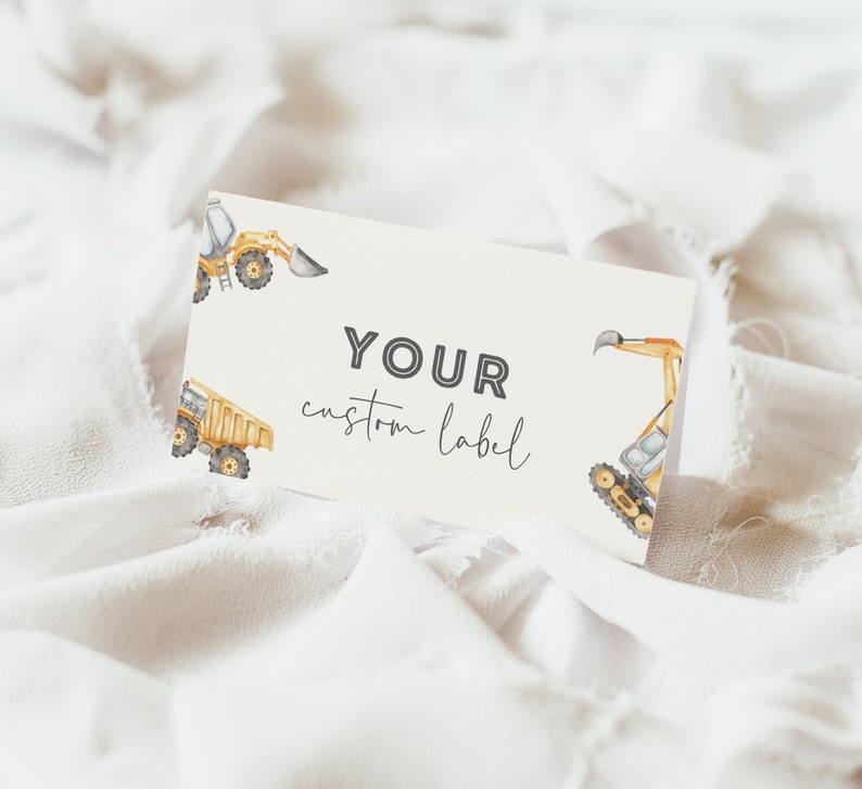 May include: A white card with the text "YOUR custom label" printed in black. The card is decorated with watercolor illustrations of yellow construction vehicles, including a dump truck and an excavator.