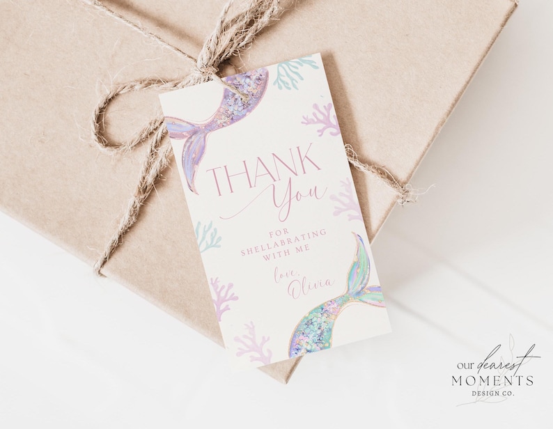 May include: Thank you card with a mermaid tail and coral design. The card says "Thank You" and "For celebrating with me. Love, Olivia."