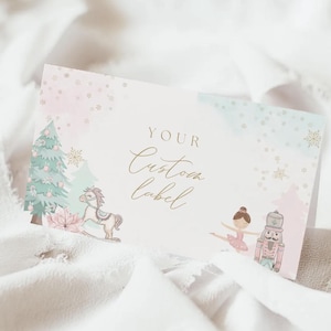 May include: A custom label with a watercolor design featuring a Christmas tree, rocking horse, ballerina, and nutcracker. The label has a soft pink and blue watercolor background with the words "YOUR Custom label" in elegant script.