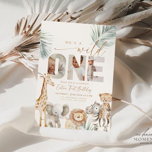May include: A party invitation with the text "HE'S A WILD ONE" and the word "ONE" featuring two photos. The invitation includes illustrations of a giraffe, elephant, lion, zebra, and cheetah. The invitation is for a first birthday.