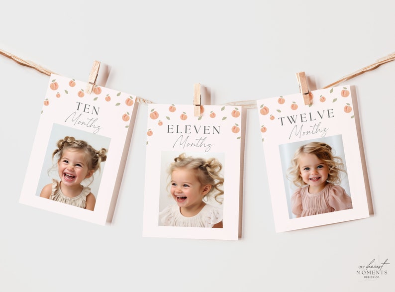 May include: A peach-themed baby milestone banner with photos of a baby girl at 10, 11, and 12 months old. The banner features a pink background with peach illustrations and the text "Ten Months", "Eleven Months", and "Twelve Months".