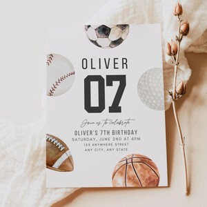 May include: A rectangular birthday invitation card featuring watercolour illustrations of a football, baseball, golf ball, American football, and basketball. The text reads OLIVER 07, Join us to celebrate, OLIVER'S 7TH BIRTHDAY, SATURDAY, JUNE 2ND AT 4PM, 123 ANYWHERE STREET, ANY CITY, ANY STATE.