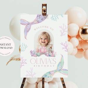 May include: A printable welcome sign for a mermaid-themed birthday party. The sign features a purple mermaid tail, a photo frame with a girl's picture, and the text "Welcome to Olivia's Birthday".