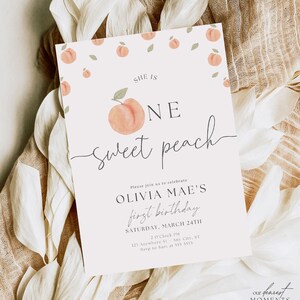 May include: A peach-themed first birthday party invitation with a watercolor peach illustration and the text "She is One Sweet Peach". The invitation includes the birthday girl's name, Olivia Mae, the date and time of the party, and the address. The invitation is decorated with small peach illustrations and green leaves.