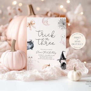 May include: A printable Halloween party invitation in pink and white. The invitation features a cute illustration of a witch, a ghost, a cauldron, and a spider web. The text on the invitation reads "Trick or Three" and includes details for a third birthday party.