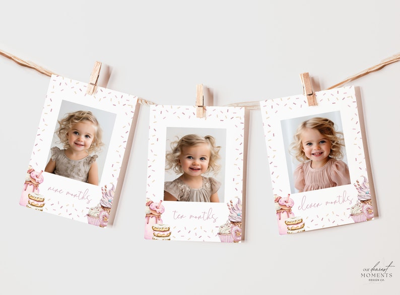 May include: Three white photo cards with pink and gold sprinkles, each featuring a photo of a baby girl and the text "nine months", "ten months", and "eleven months".