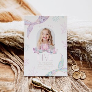 May include: A mermaid-themed birthday invitation with a watercolor background. The invitation features a mermaid tail, seashells, and coral. The text on the invitation reads "Dive Into Five" and includes the birthday girl's name and party details.