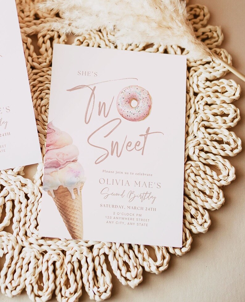 May include: A pale pink invitation card featuring the text "She's Two Sweet" and illustrations of a donut and ice cream cone. The card is for Olivia Mae's second birthday, with the date, time, and address.