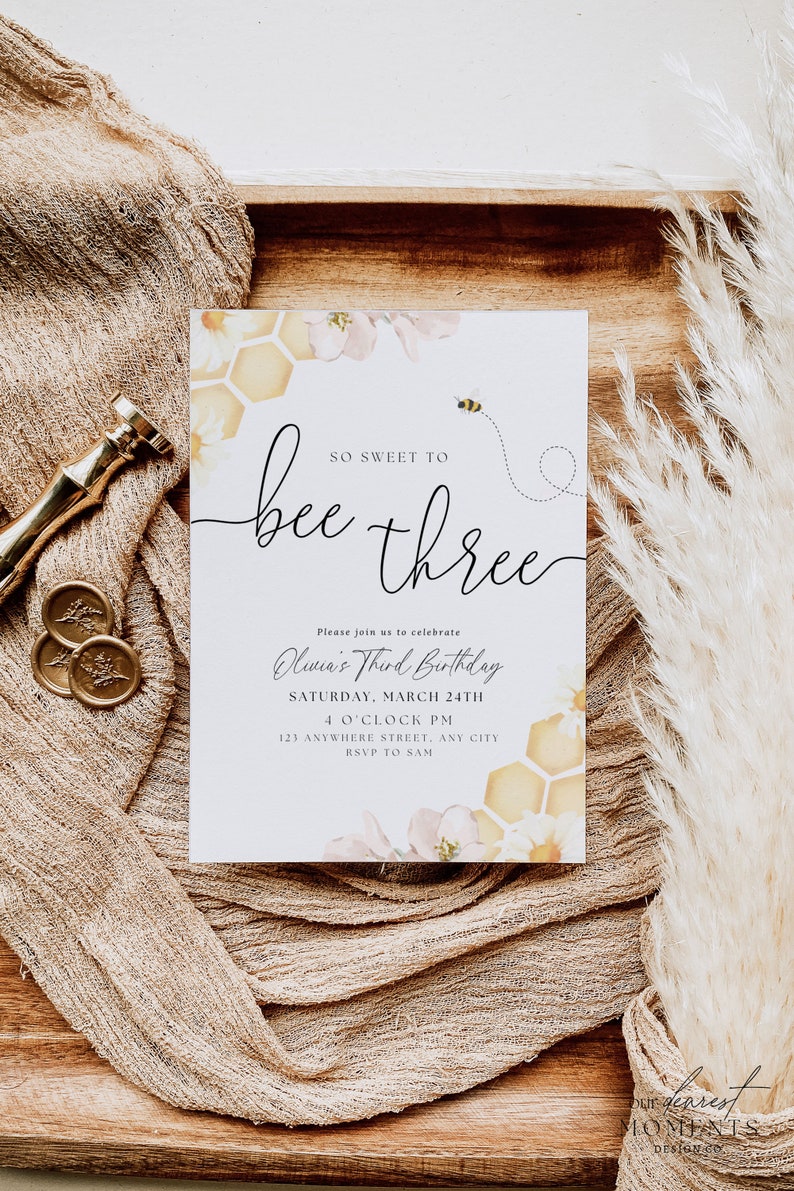 May include: A bee-themed birthday invitation featuring a yellow and white honeycomb pattern, pink flowers, and a bee flying above the text "So Sweet to Bee Three". The invitation includes the text "Olivia's Third Birthday" and details for the event, including the date, time, and location.