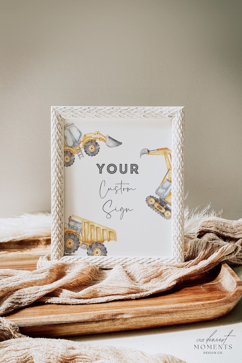 May include: A white framed sign with a watercolor illustration of construction vehicles. The sign says "YOUR Custom Sign".