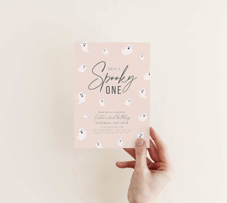 May include: A pink invitation with a white ghost pattern. The text reads "He's a Spooky One" and includes details for Easton's first birthday party.